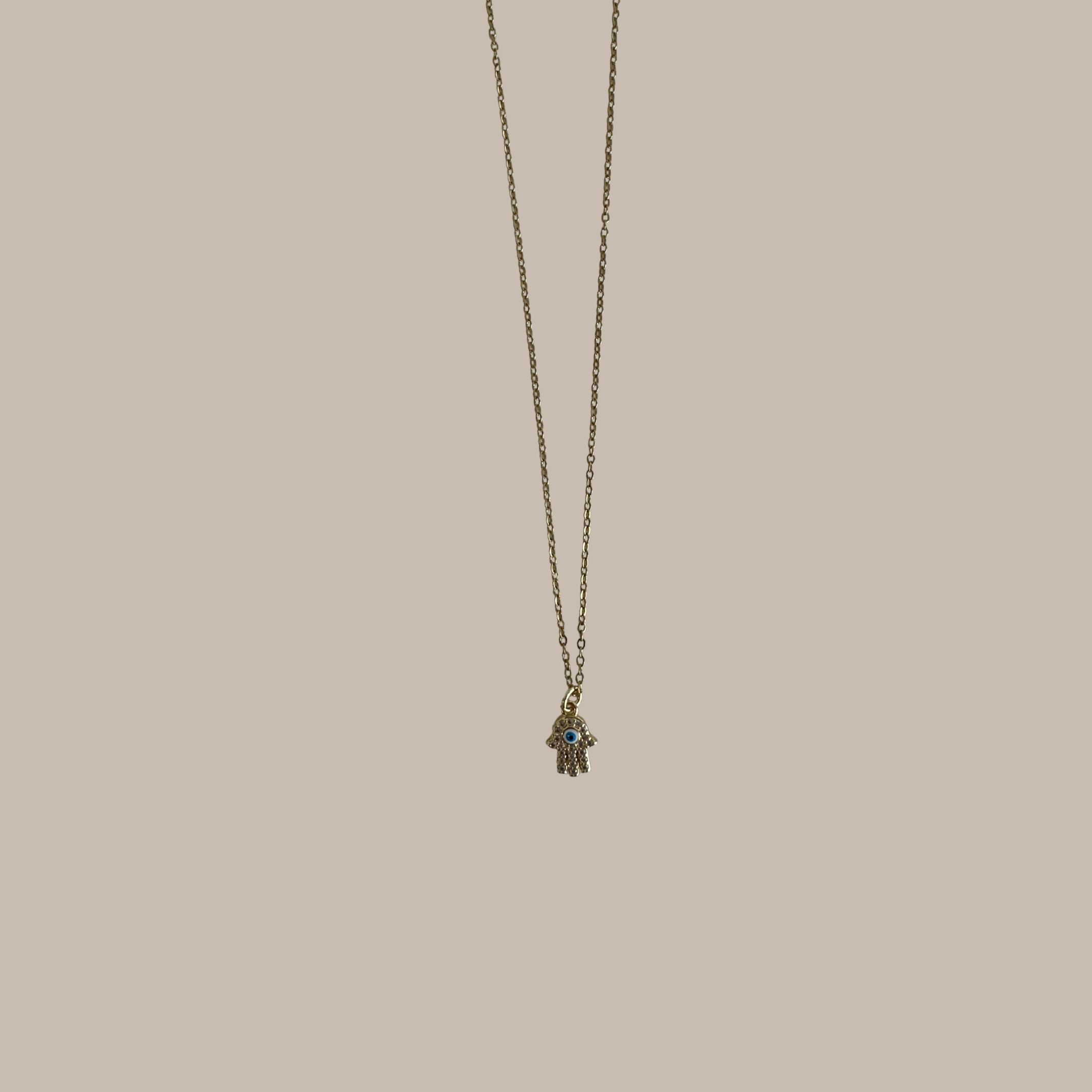 COLLAR DORADO OJO