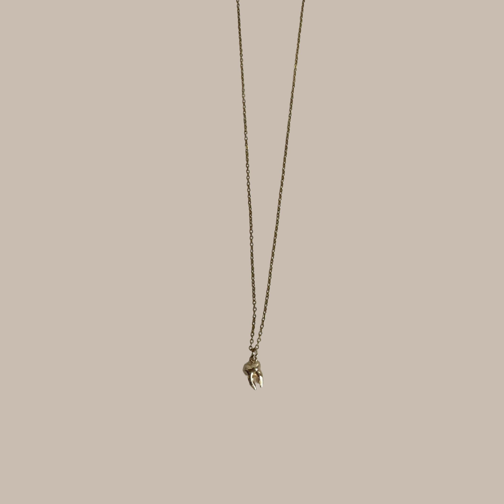 COLLAR MUELA DORADO